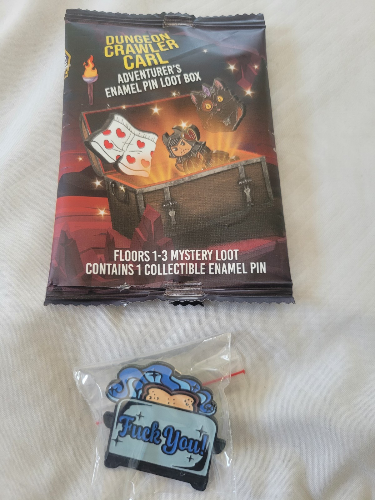 Dungeon Crawler Carl Enamel Pin – Foam Brain Games – Mana Toast