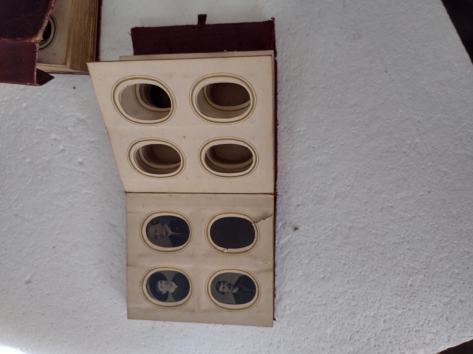 Tintype portraits in two old L;eather Albums 4x4x1