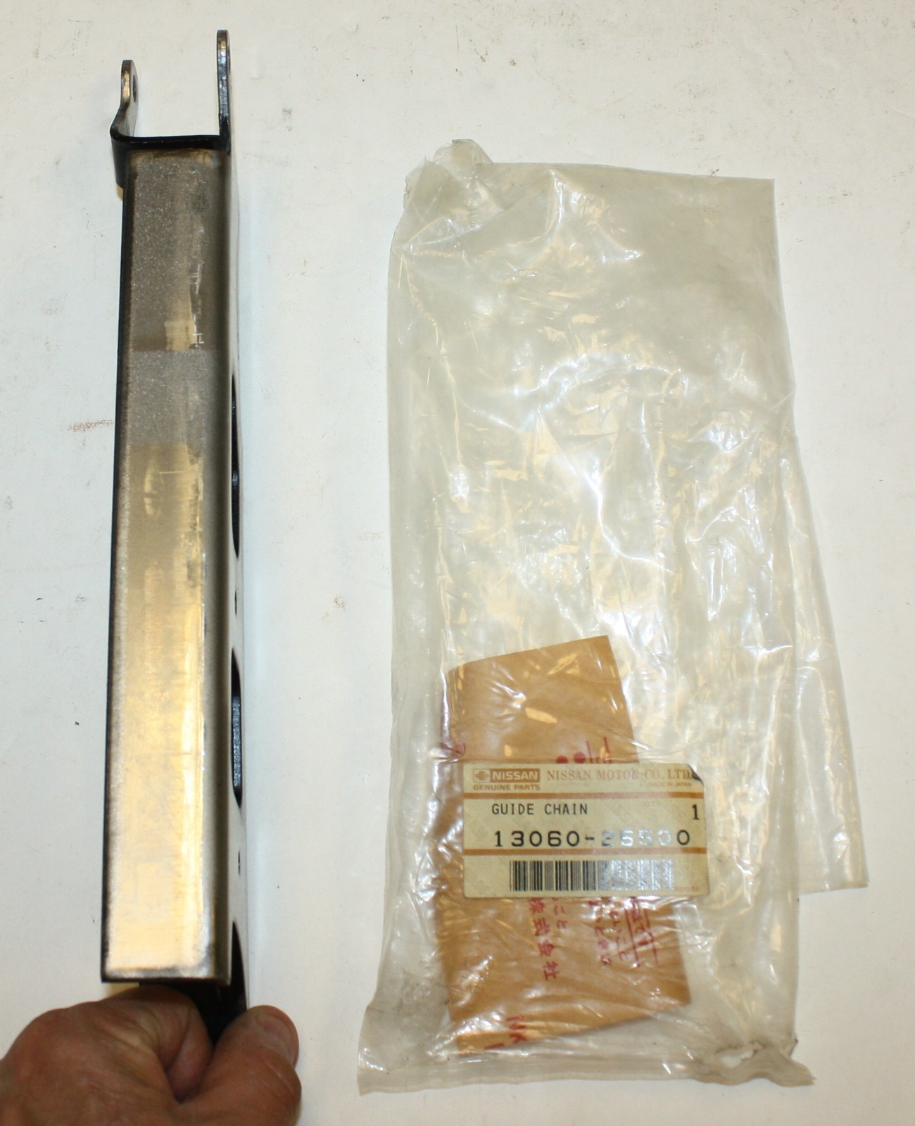 Datsun 2000 Roadster Upper Timing Chain Guide: Nissan Part 13060-25500