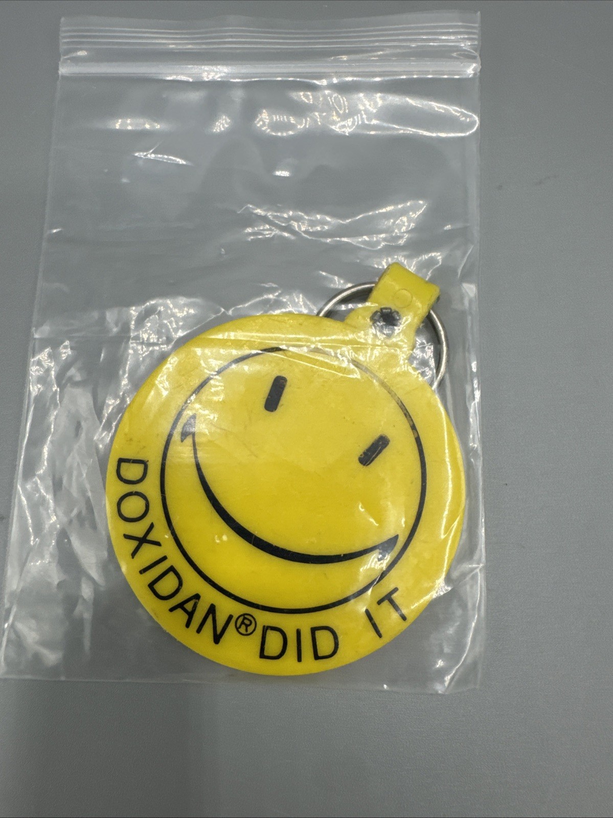 Drug Rep Key Chain “Doxidan Did It” Pharmaceuticals Yellow Smiley Face Some Wear