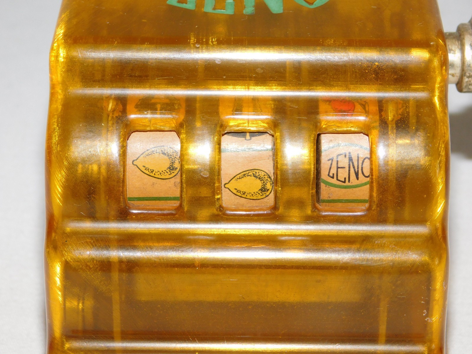 VINTAGE TRADE STIMULATOR 3 1/4" HIGH ZENO TOY SLOT MACHINE