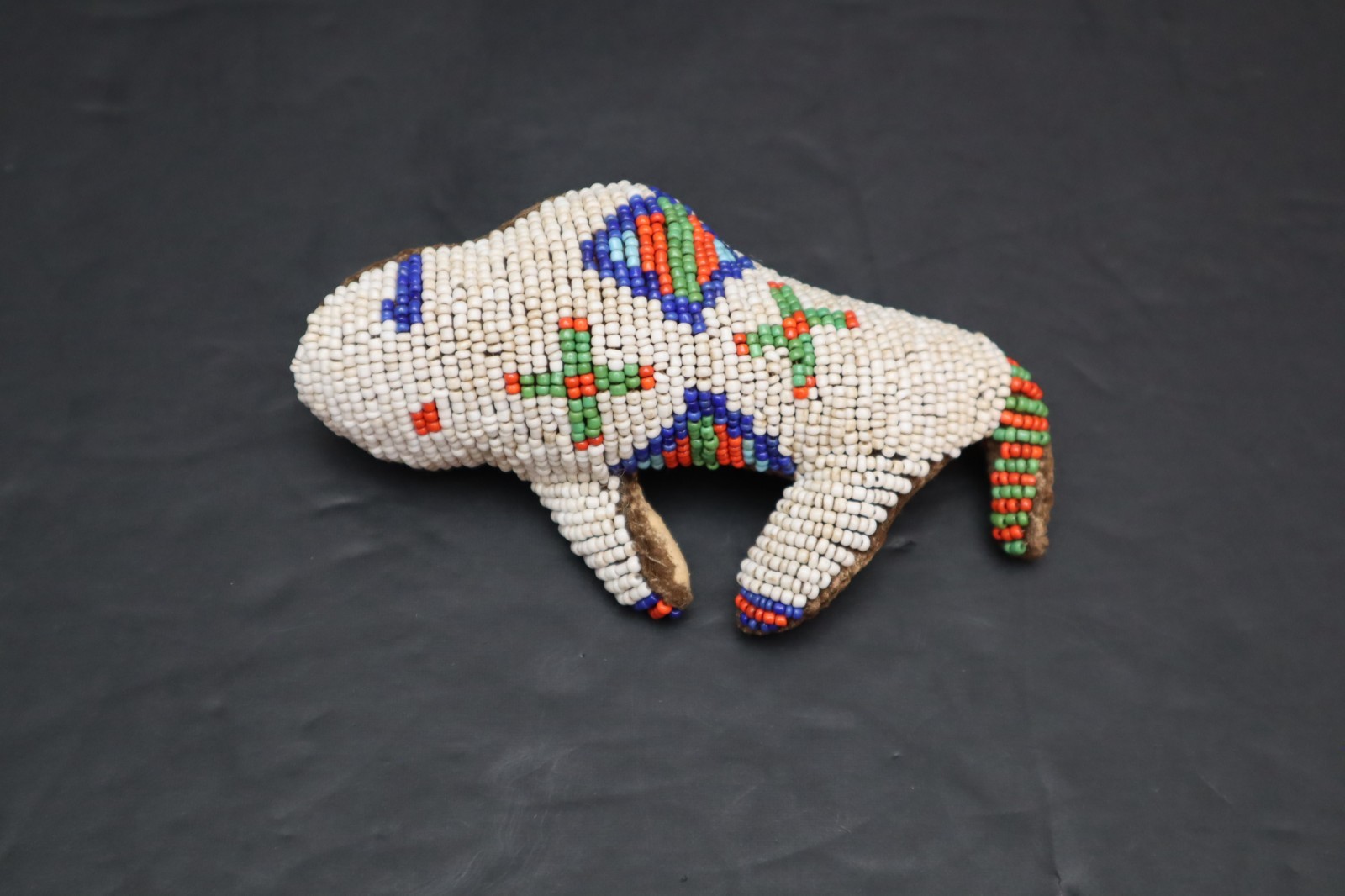 HAND MADE NATIVE AMERICAN BEADED LEATHER FETISH, BUFFALO AMULET