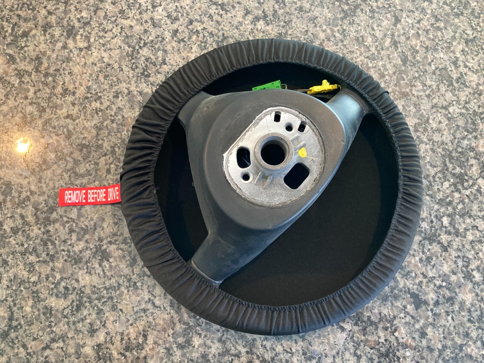 PORSCHE DESIGN OEM FACTORY STEERING WHEEL PROTECTIVE COVER IN BLACK W/CREST. NEW