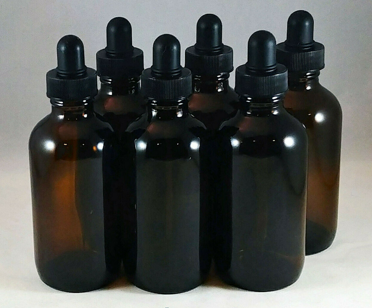 4 oz Amber Boston Round Glass Bottles w Caps, Droppers, Phenolic, Mult Lot Sizes
