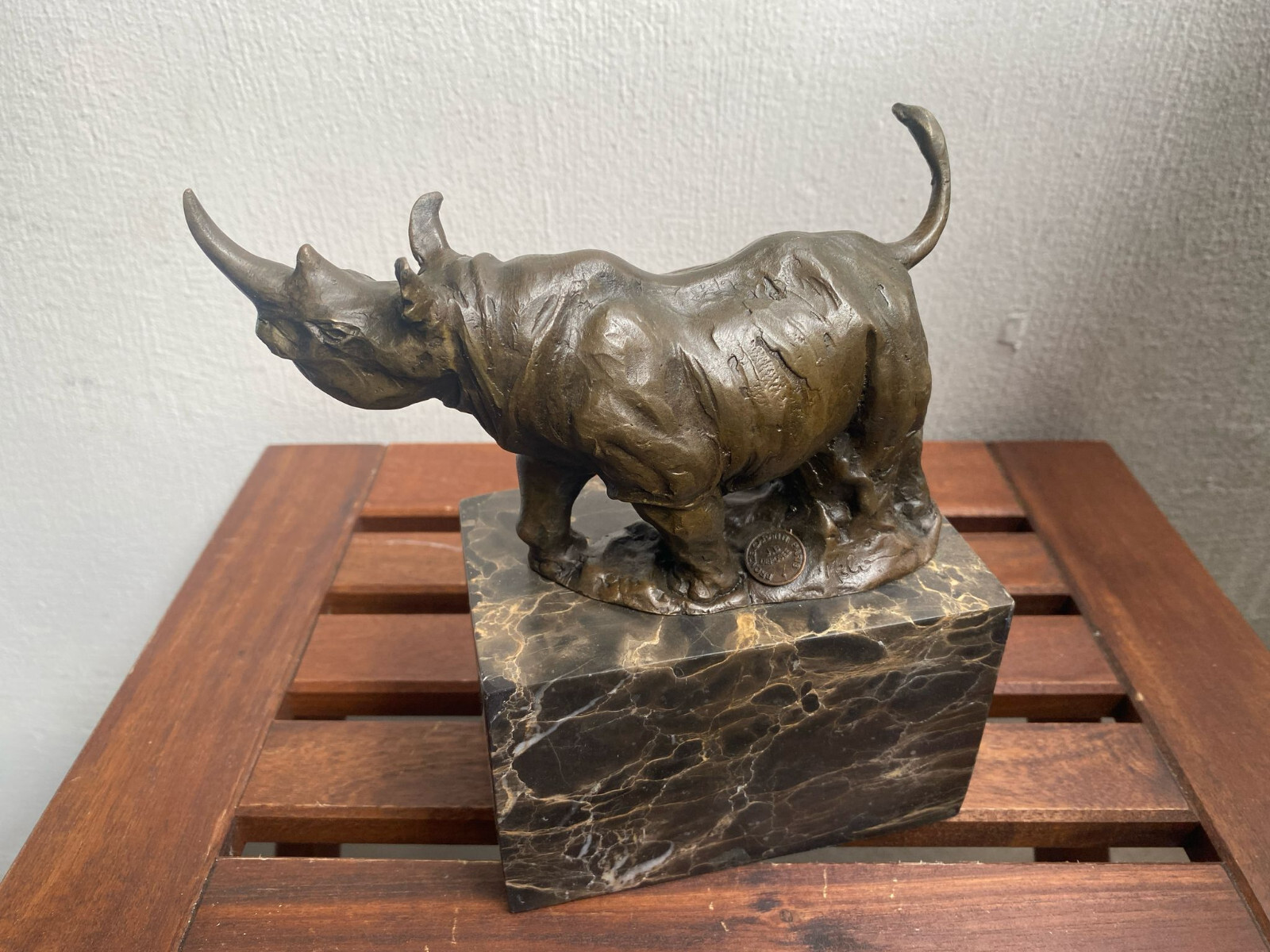Bronze sculpture Walking Rhinoceros on a black marble base after Milo