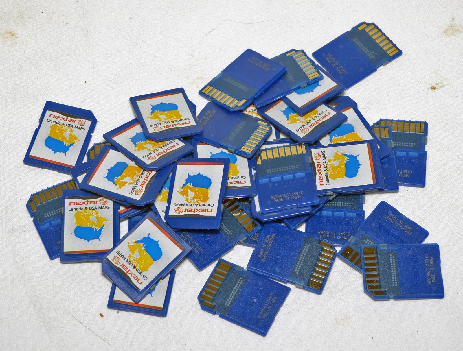 One (1) genuine Sandisk 2GB SD card with Nextar gps USA & Canada maps