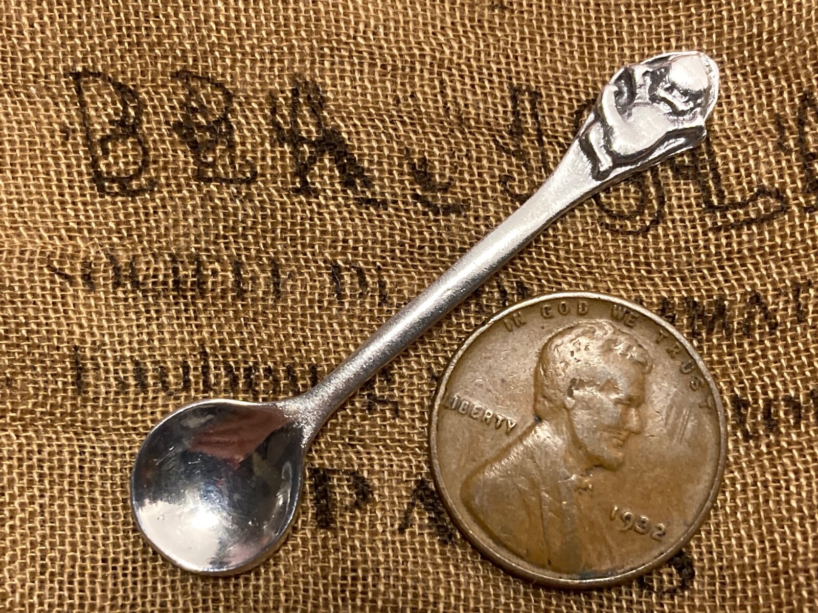 Unique Happy Kewpie Patterned Sterling silver open salt spoon