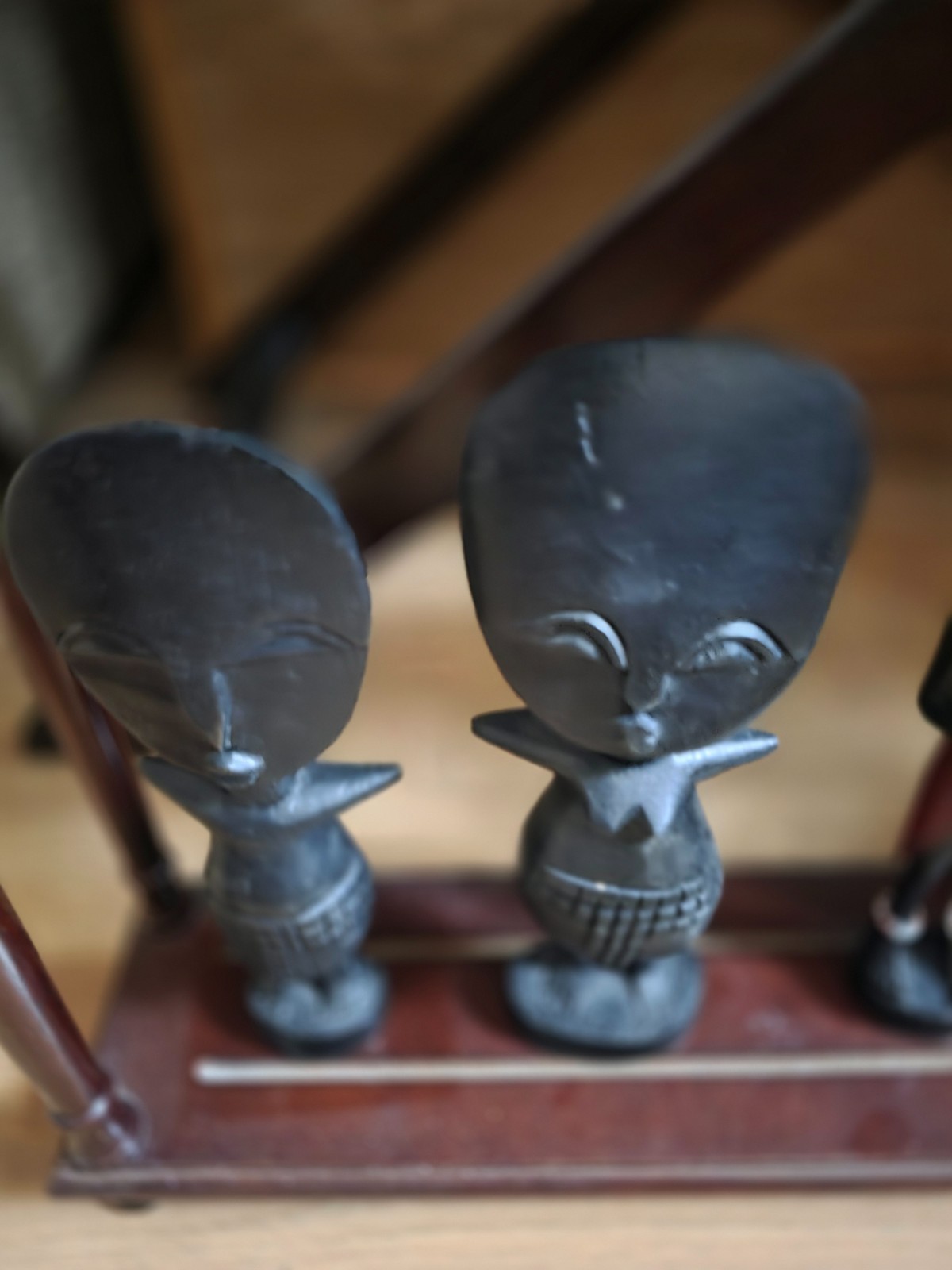 Set of carved statues from black wood, stone, bronze.