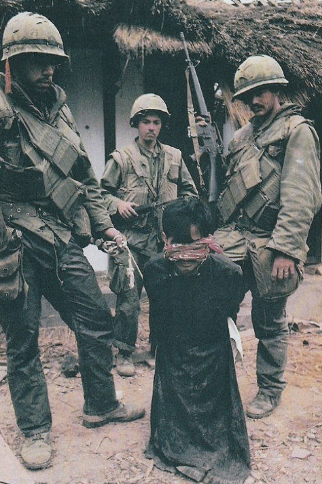 Vietnam  War  Photos --  US Soldiers  With VC Prisoner In Village,,,