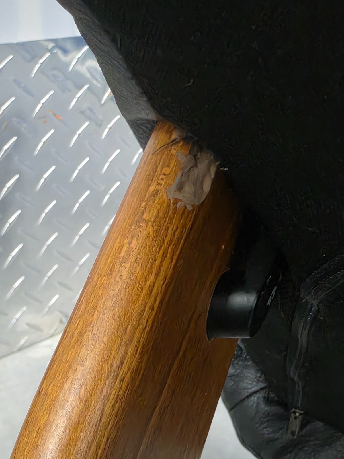 Ekornes Stressless Black Colored Leather Ottoman | Teak Stained Wood Base