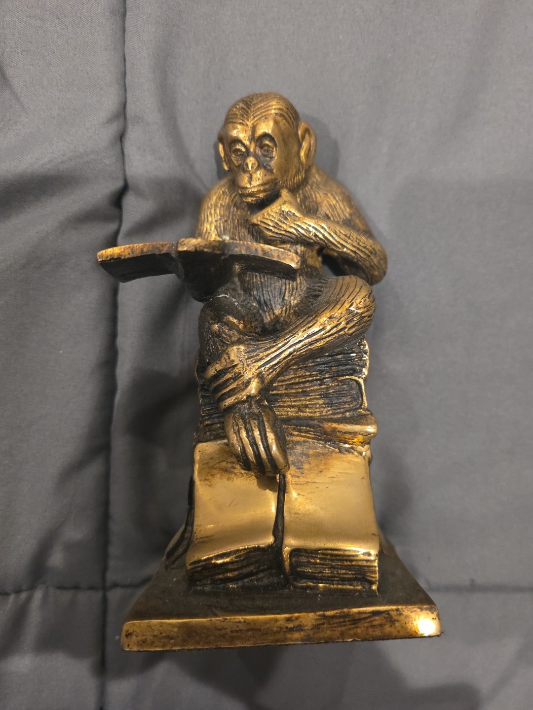 Bronze sculpture.  Monkey with a book.