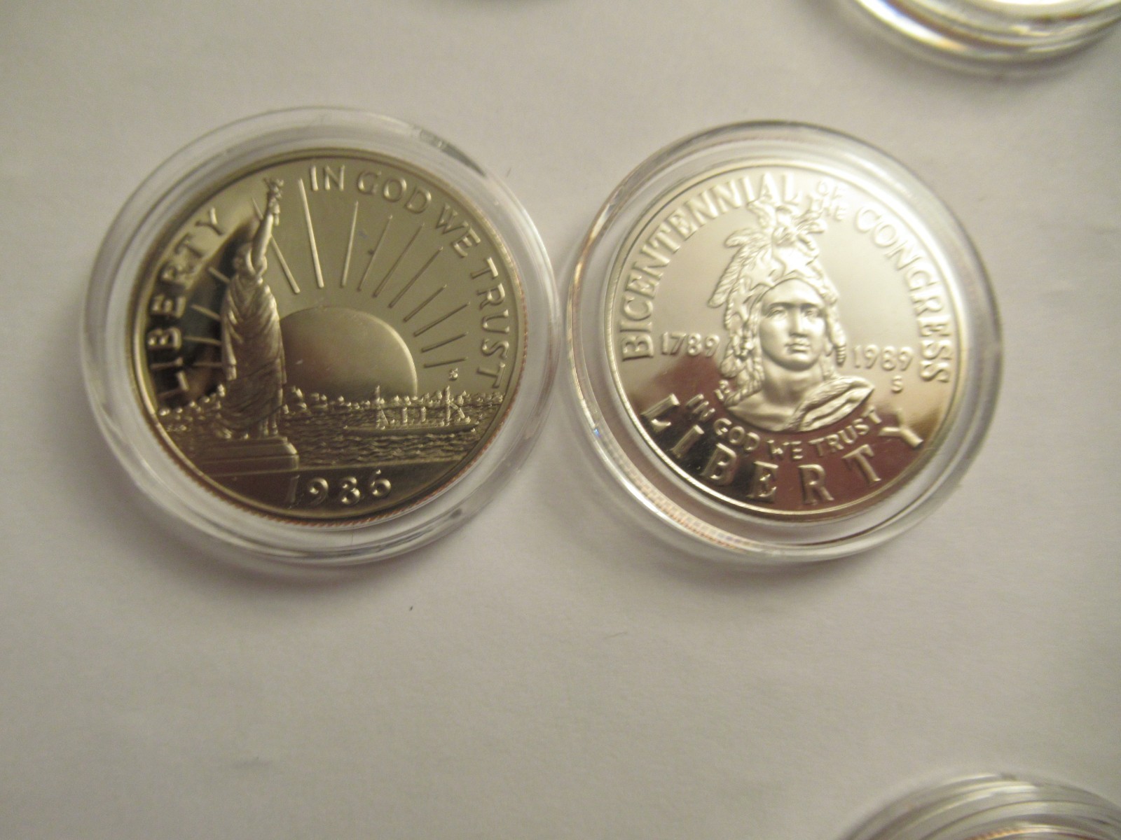 Lot of 11 US Clad half dollars, mix dates, w/ capsules