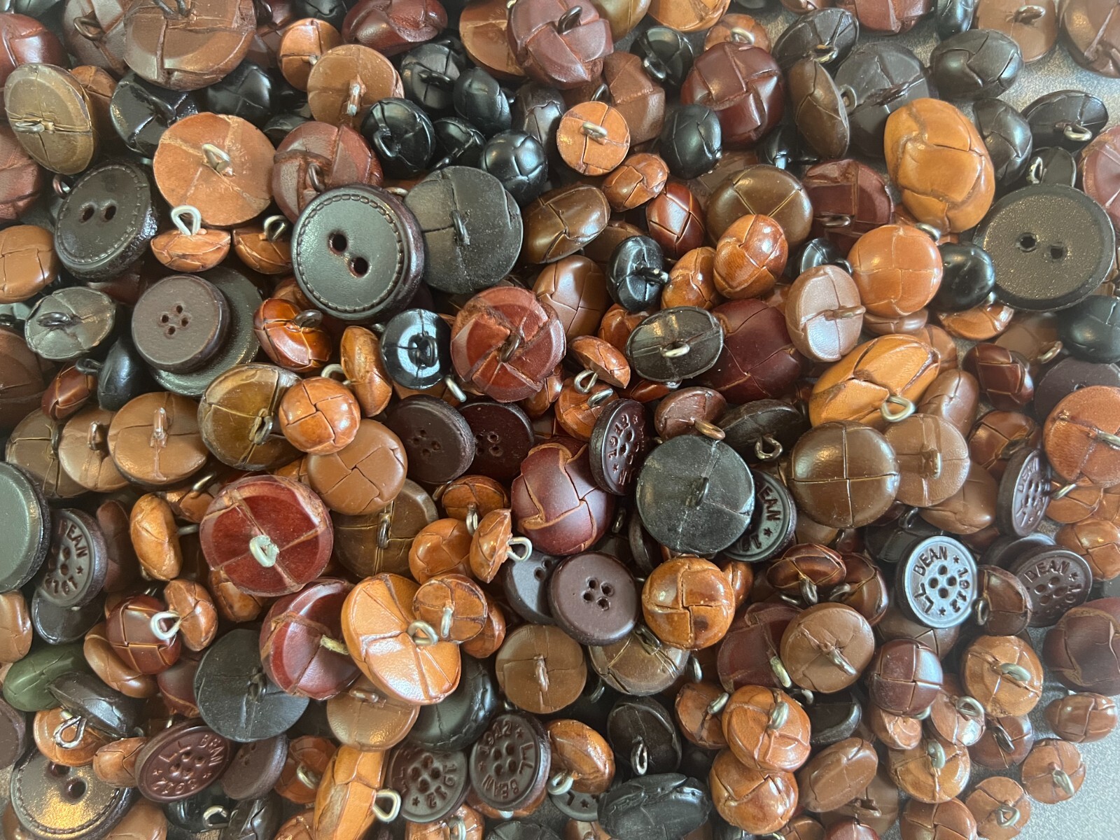 GENUINE LEATHER BUTTONS-OVERSTOCK SALE-SELLING IN ASSORTED 12 LB LOTS