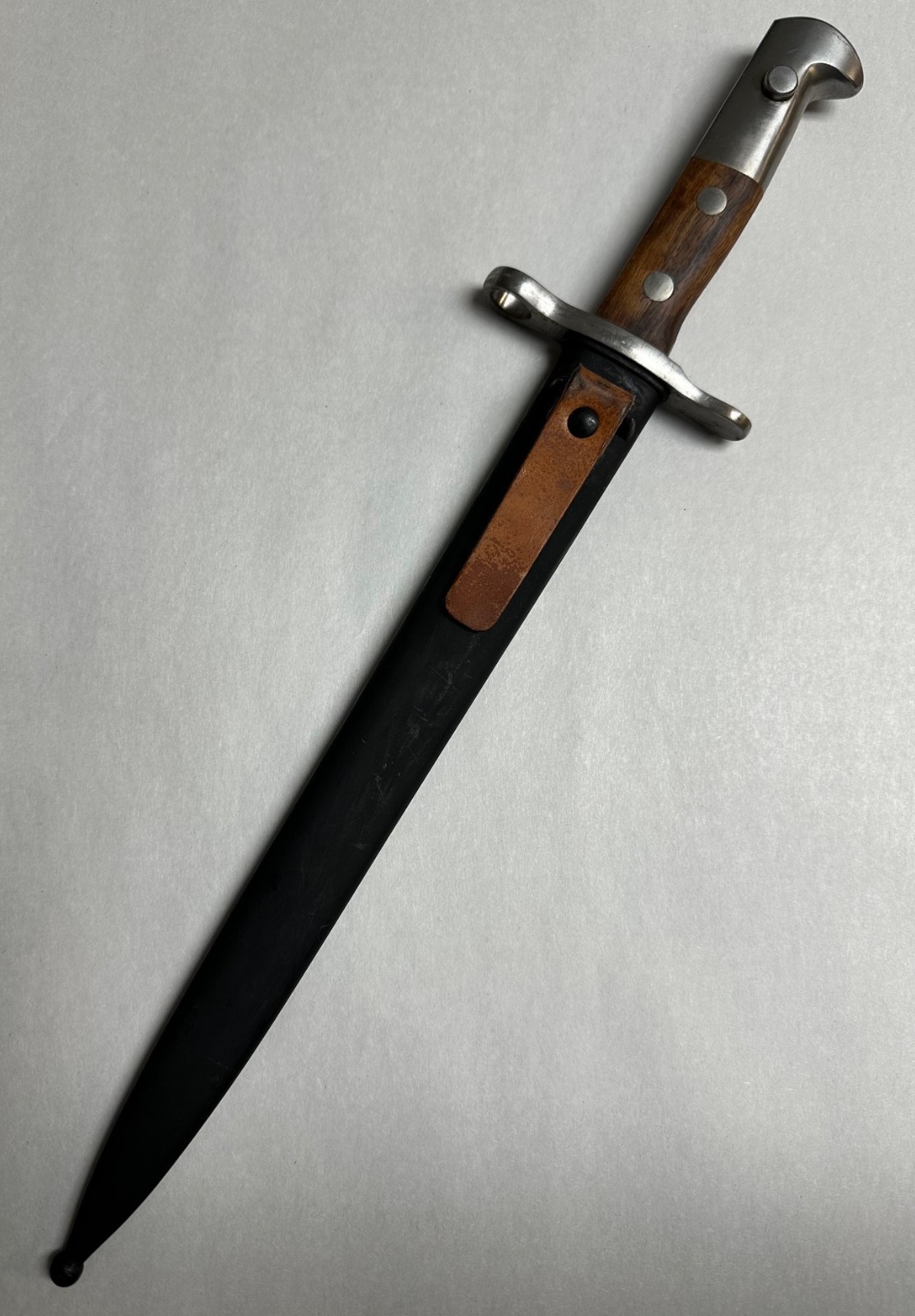 SWISS K31 BAYONET WITH SCABBARD. NEW OLD STOCK.