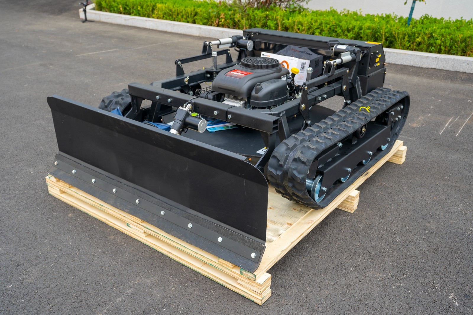 Remote-controlled lawnmower with snowplow for a limited time, available for snow