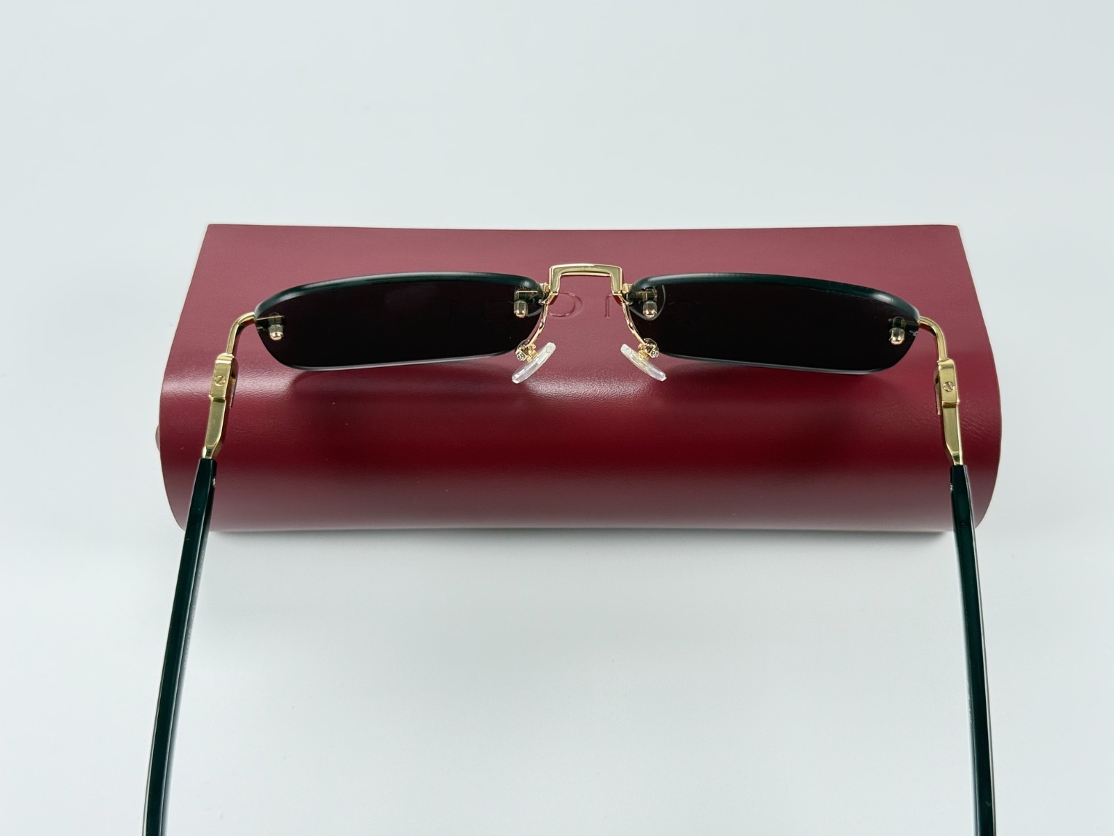 Gucci GG1221S 001 Black Gold Rimless Sunglasses Gray Lens 56mm