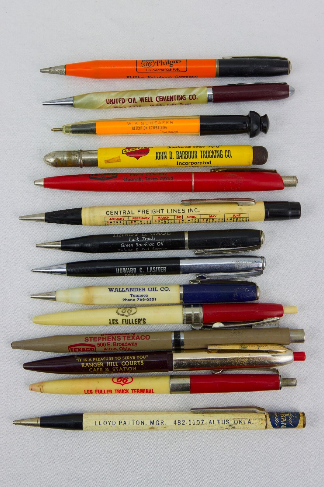 Oil, Trucking and Land Advert Items; Wood Box, Pencil Sharpener and Pens/Pencils