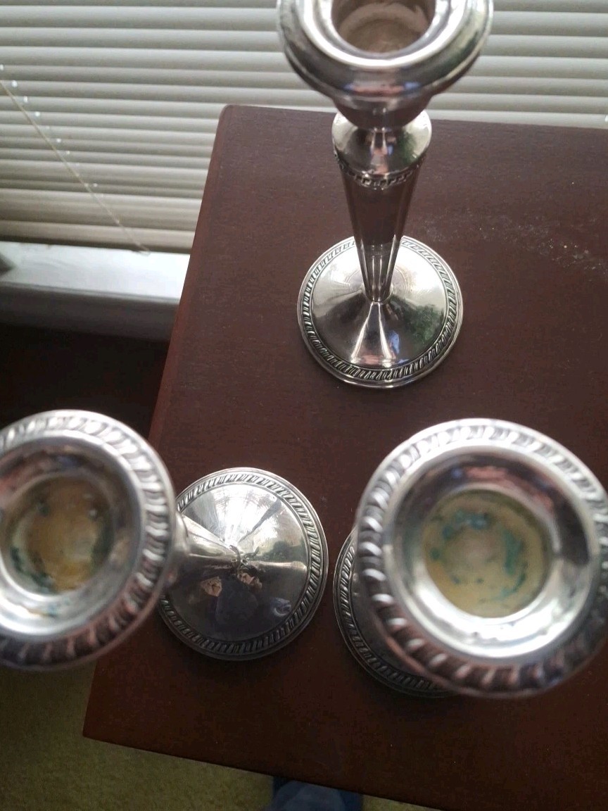 A rare Pair Of Sterling Silver Candelabras By CROWN. 8 In. Tall.