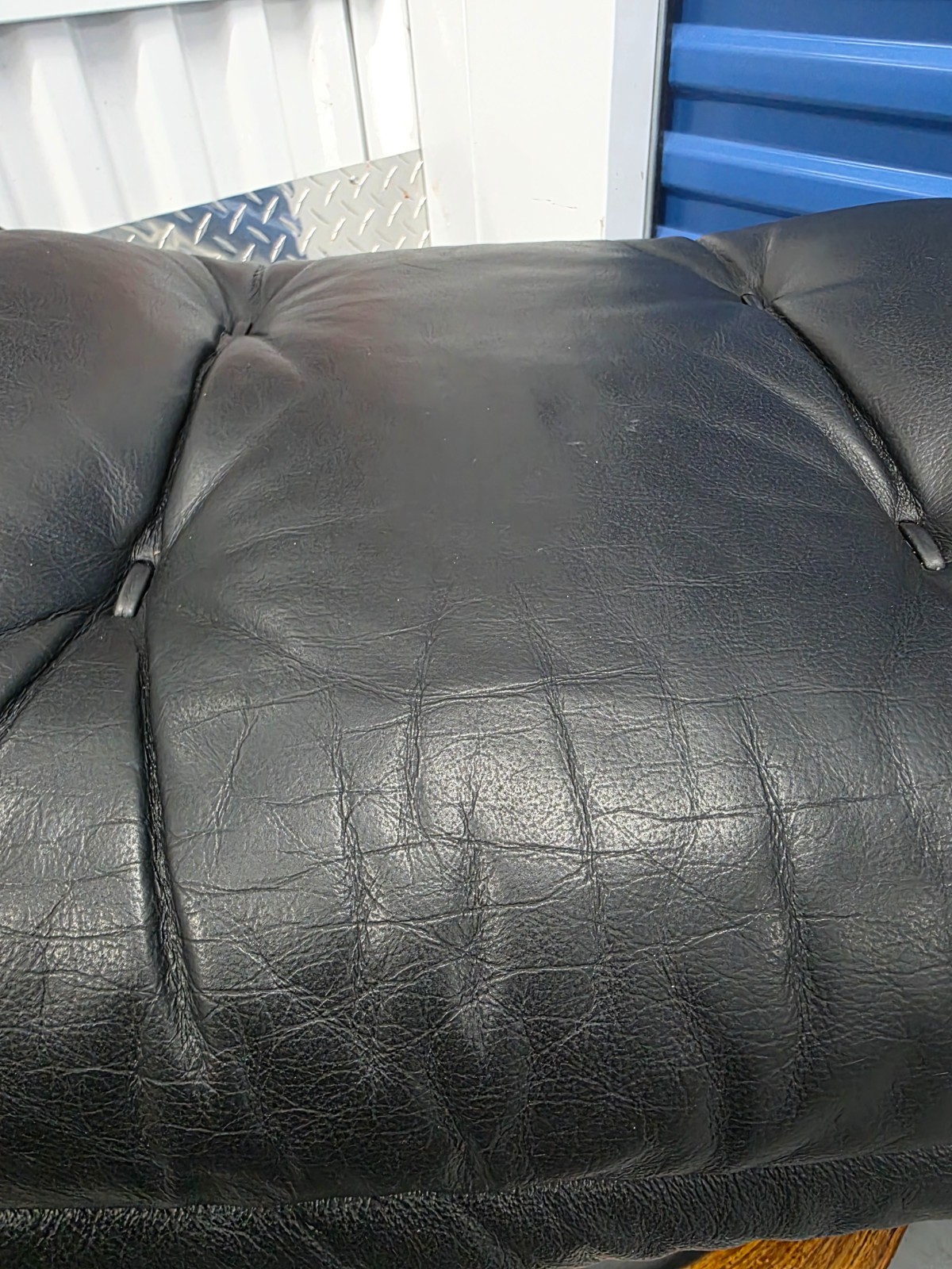 Ekornes Stressless Black Colored Leather Ottoman | Teak Stained Wood Base