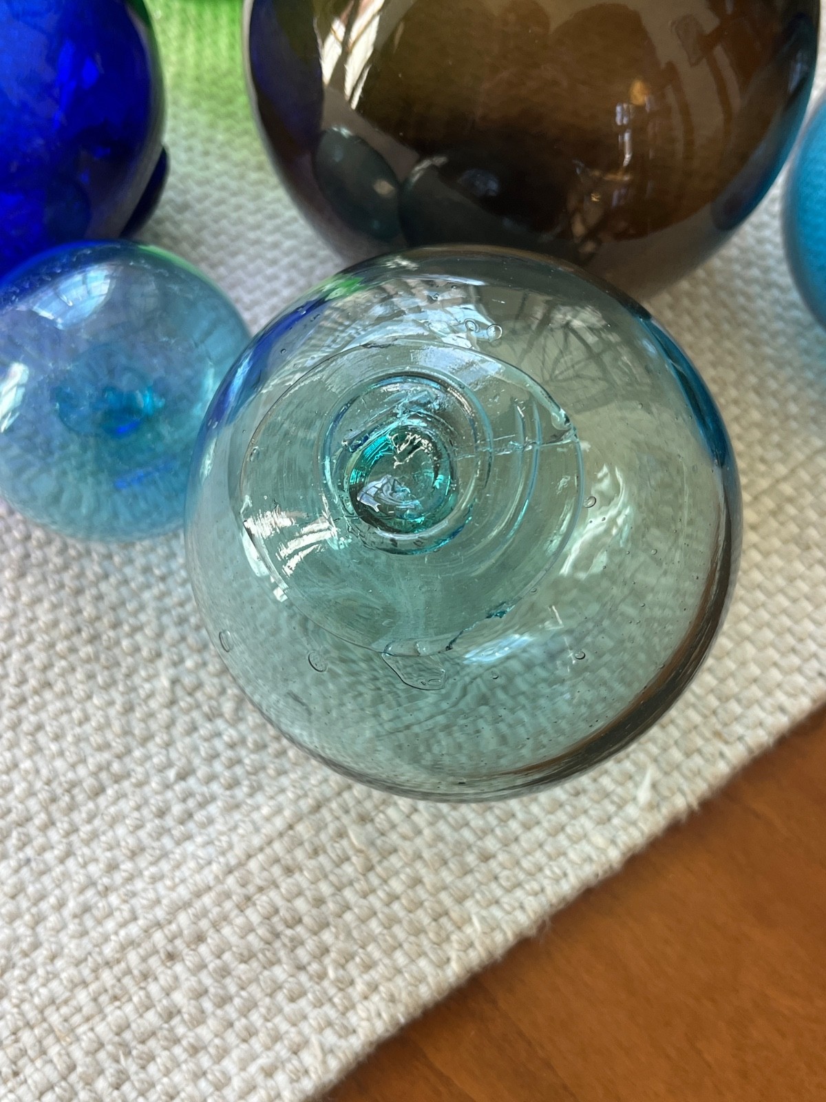 Lot of 7 vintage hand blown glass fishing floats or balls.