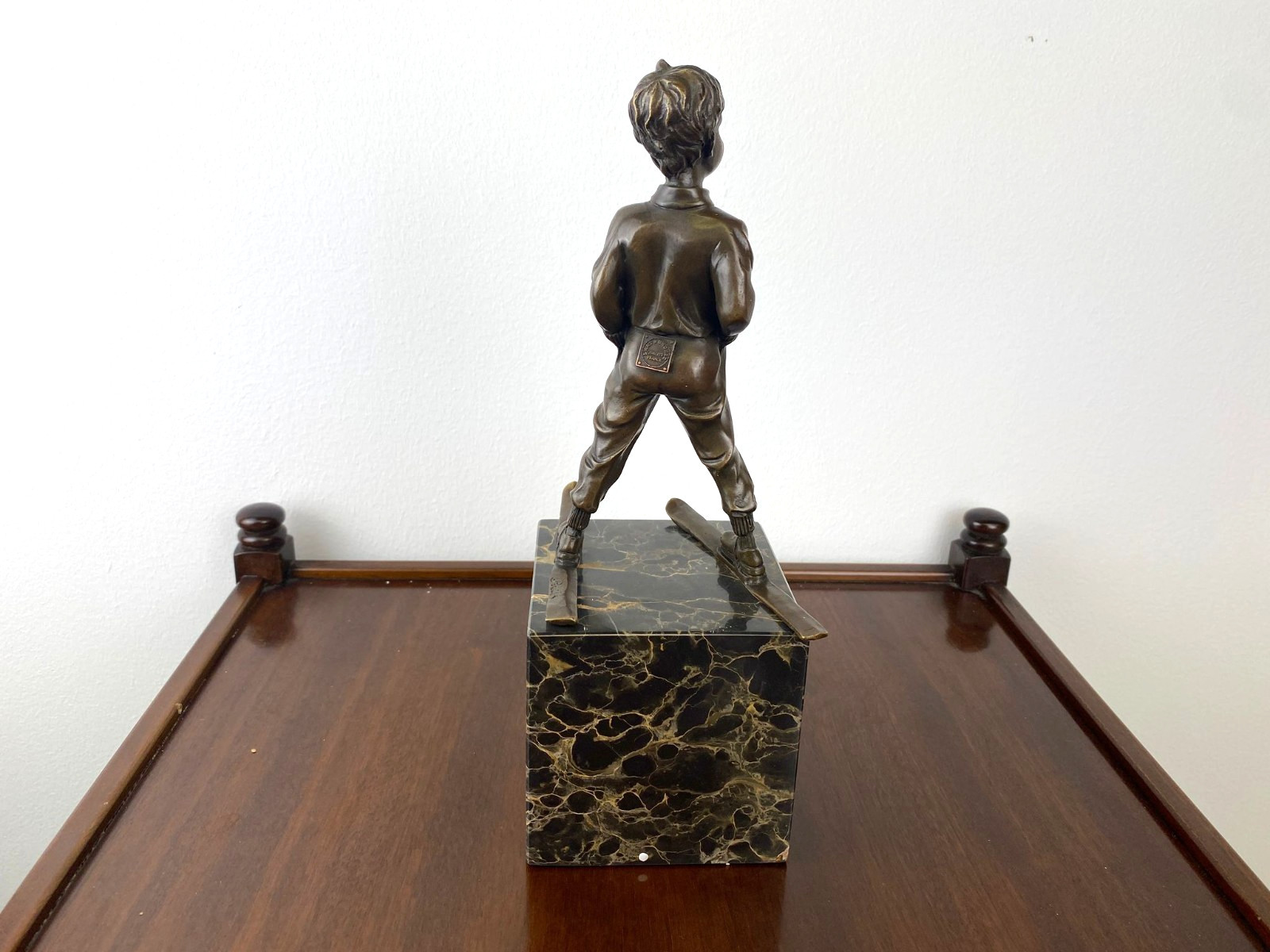 Bronze sculpture boy with ski on marble base after Ferdinand Preiss