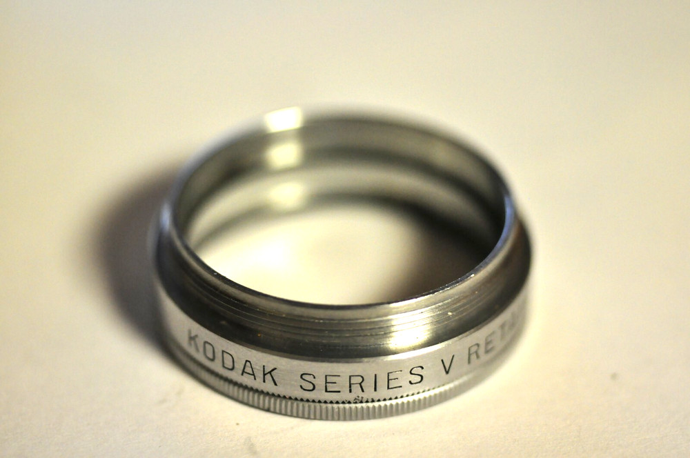 Kodak ser. V thread adapter to accept a series V filter. With retaining ring.