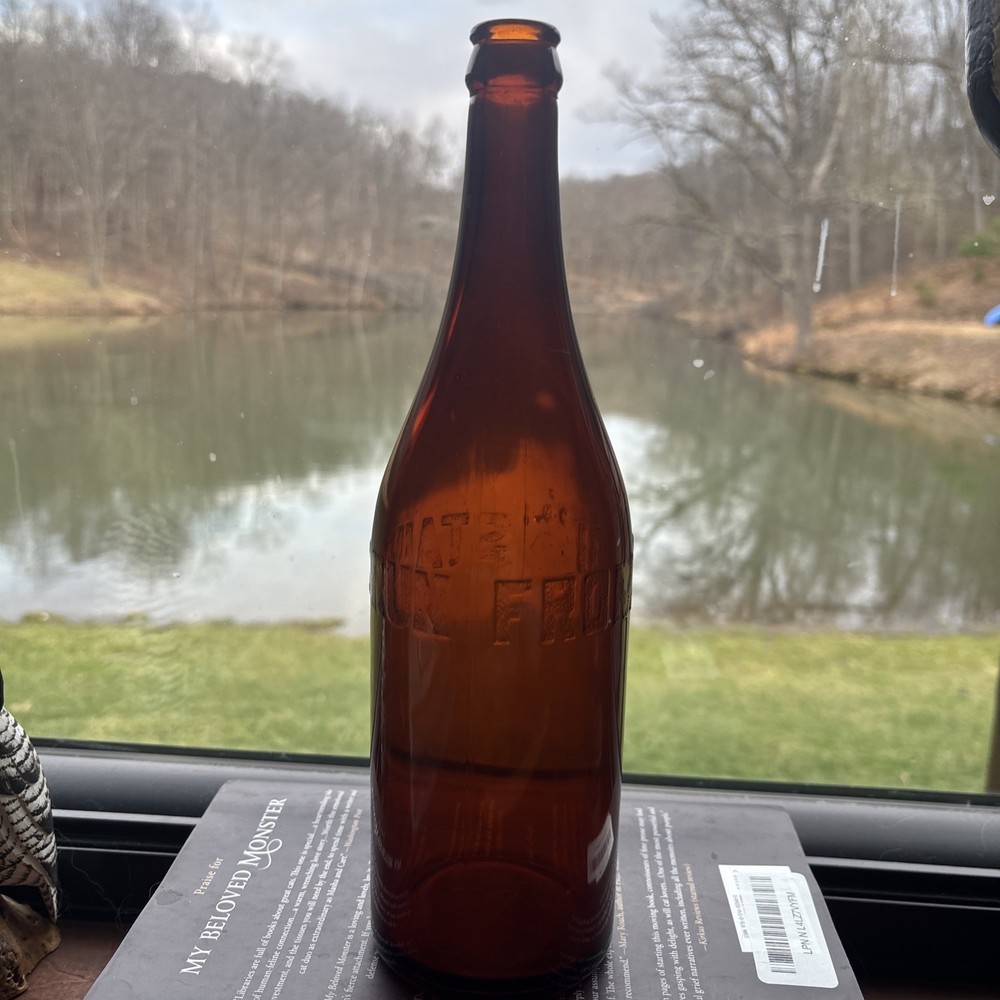Stains Run From 101 Amber Embossed Bottle