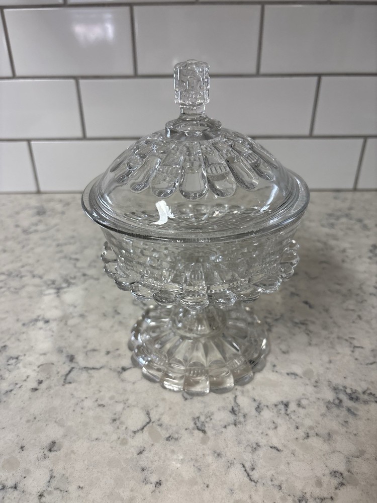 Clear pressed glass covered compote in the 'Cut Log' pattern.