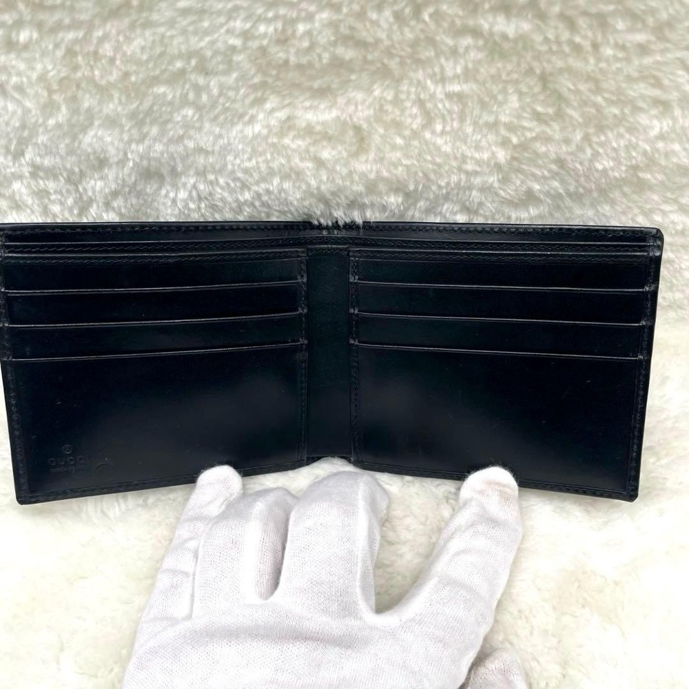 GUCCI Embossed Logo Black Folding Wallet