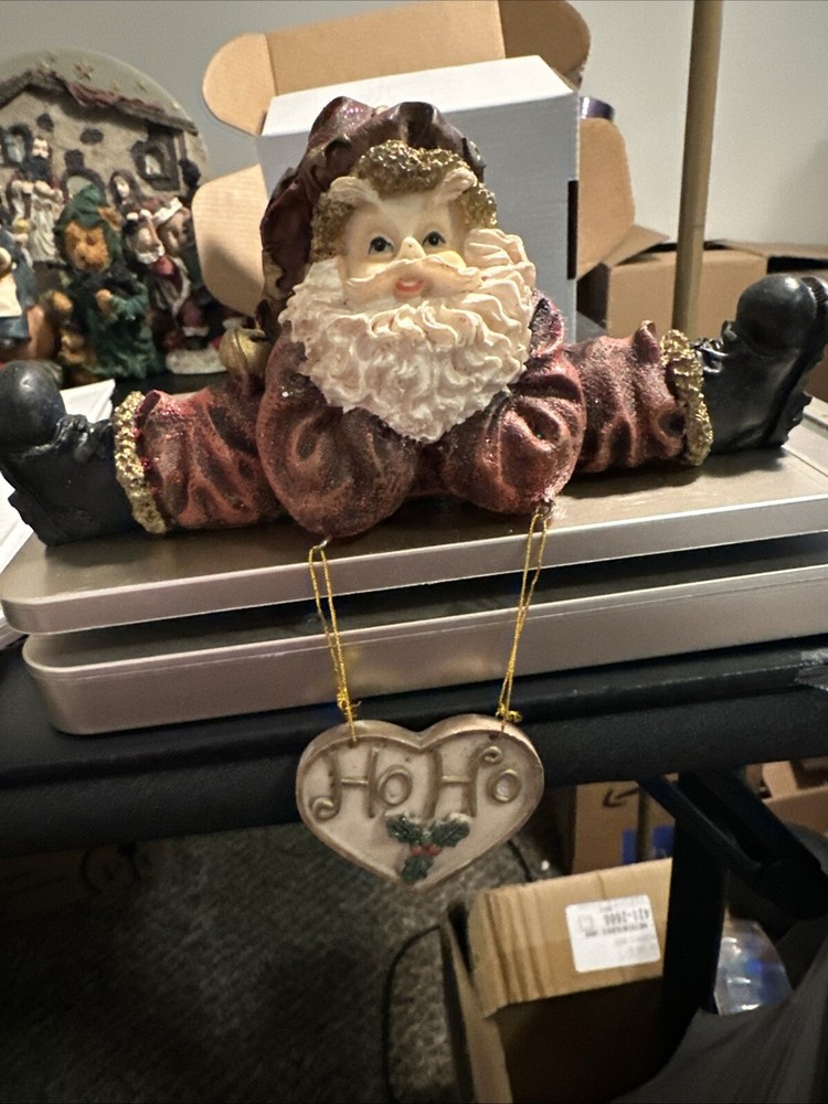 Santa Claus Doing Splits, With Dangling Heart Decor