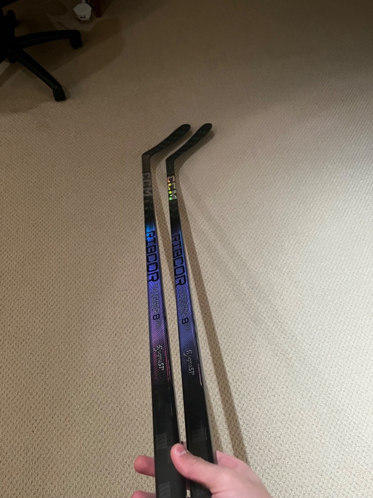 Two CCM Trigger 8 pro hockey sticks