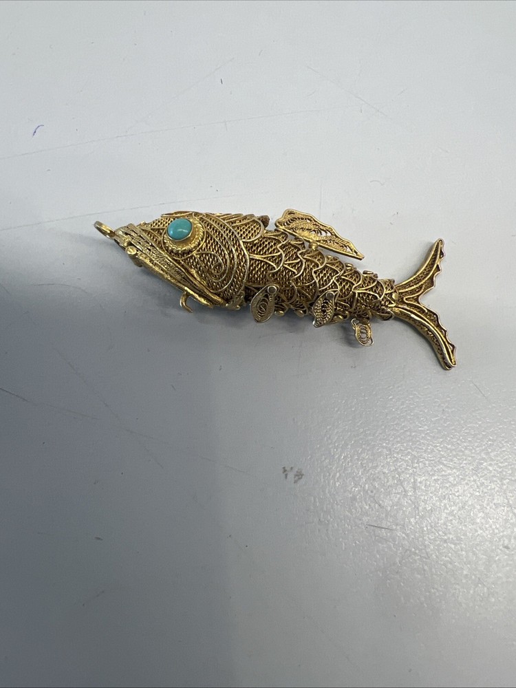 Tested as silver and gilded flexible fish, possibly pill box.