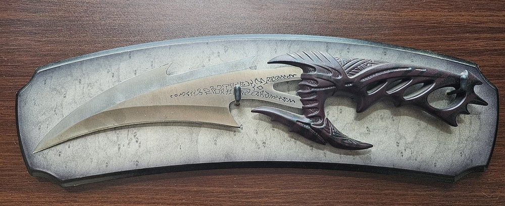 Fantasy Dragon Claw Dagger with Intricate Handle Design