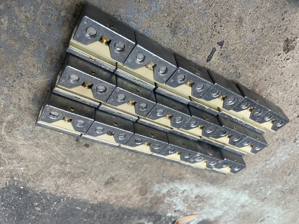 X18 Machine Rail Sliders with hardware for round rail, used