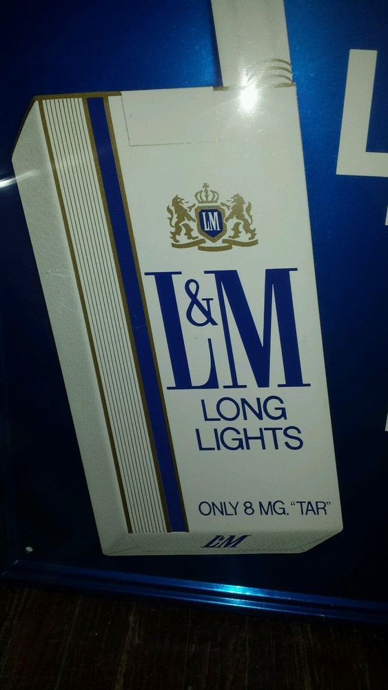 LM cigarette advertising sign.