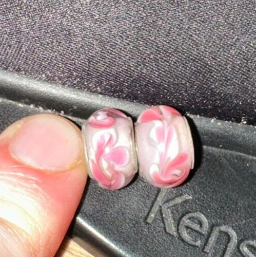 two matching pink patterned charms For Charm Braeclets