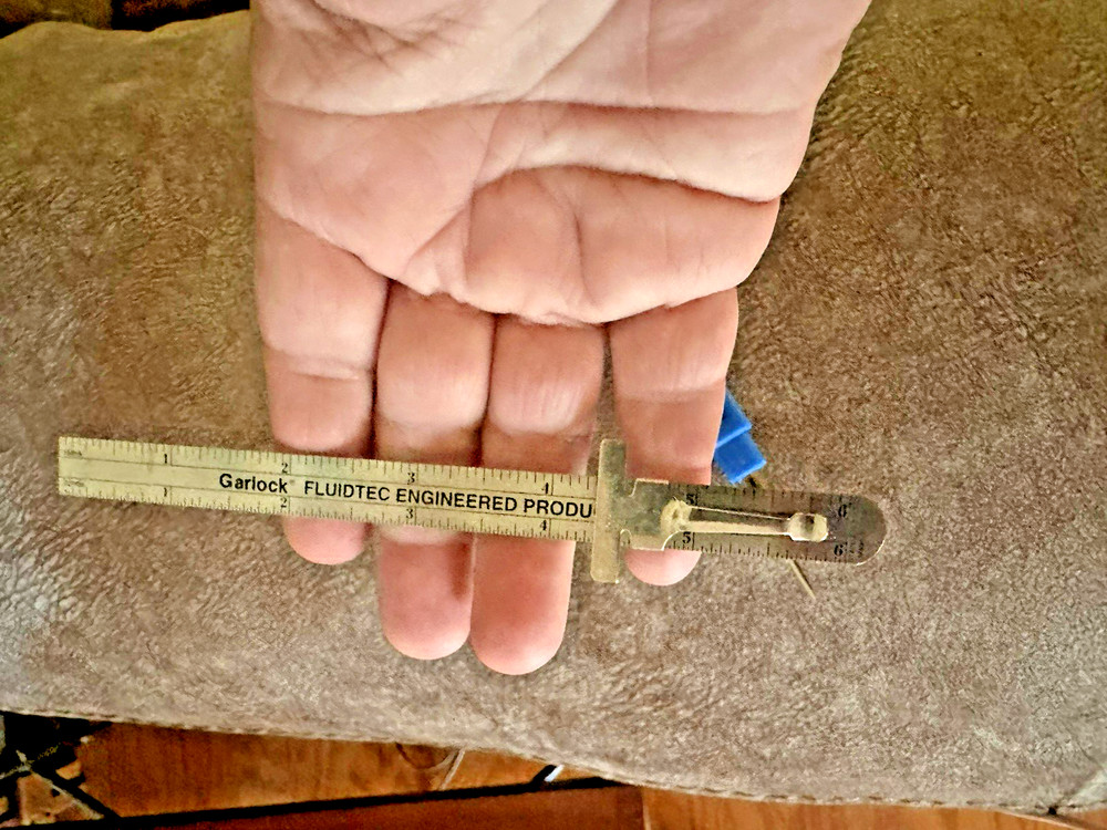 Garlock Slide Ruler and a Seam Ripper