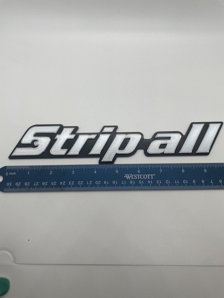 Strip-all Novelty 3D Printed Tool Box Badge.