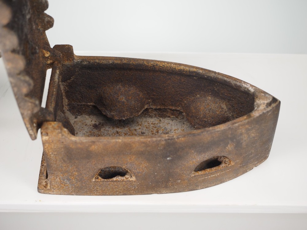 Antique cast iron coal fired clothing iron
