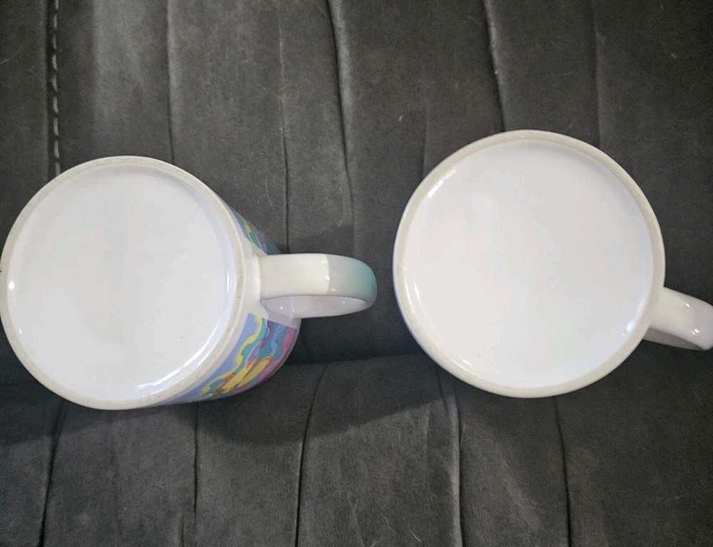 Easter themed ceramic mug set featuring pastel chicks and decorated eggs
