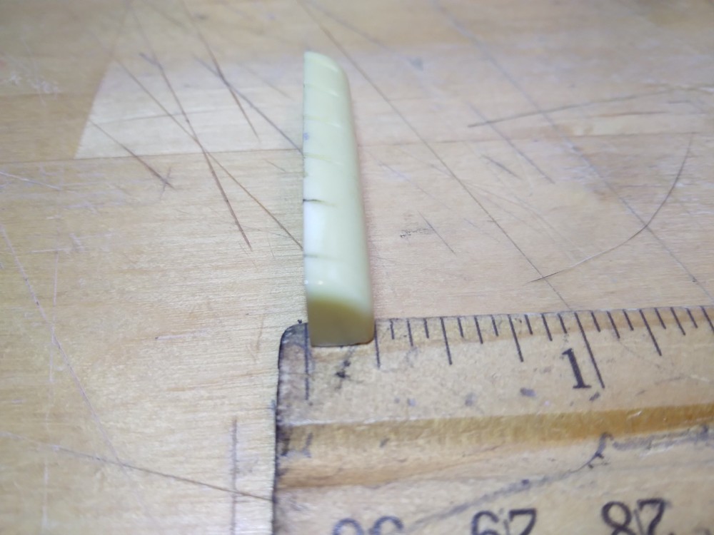 Vintage unbranded Plastic guitar Nut, white