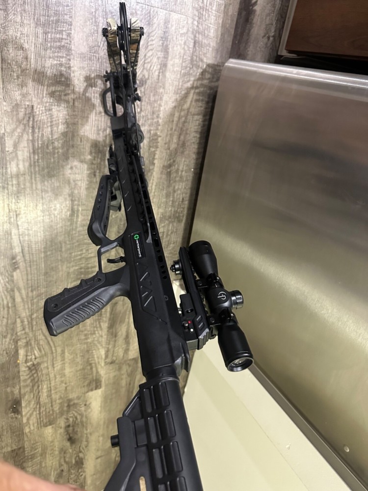 crossbow , with case arrows broadheads and pull cord.