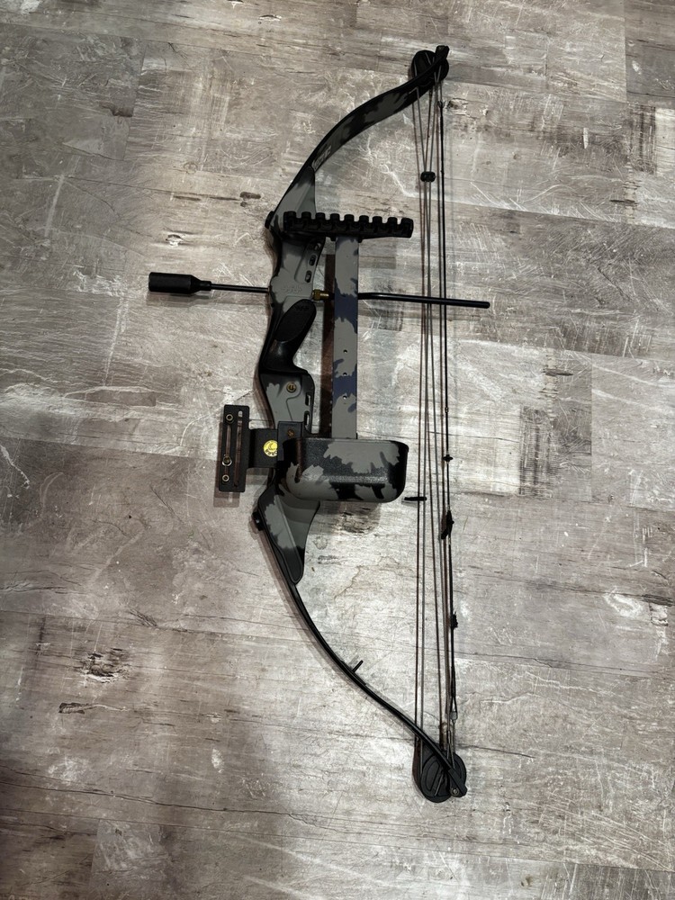This item is a PSE Polaris Express bow riser, featuring a camouflage design.