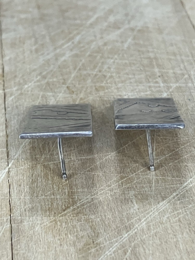 Handcrafted sterling silver studs featuring oxidized Southwestern Style Native