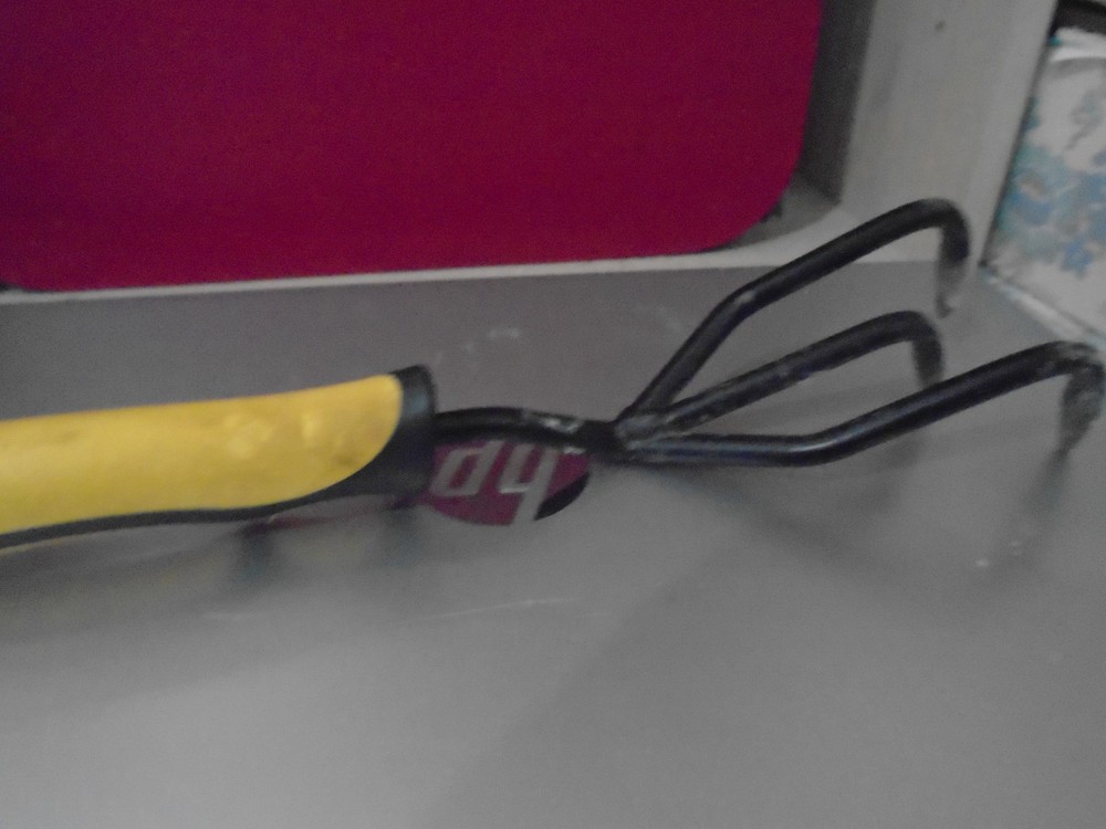 Hand garden fork with yellow soft handle. Flawless.