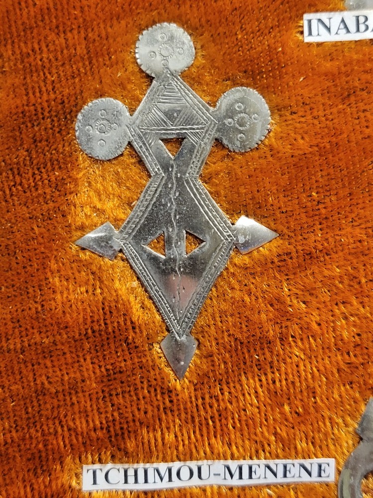 Collection of Hand-tooled Tin Badges