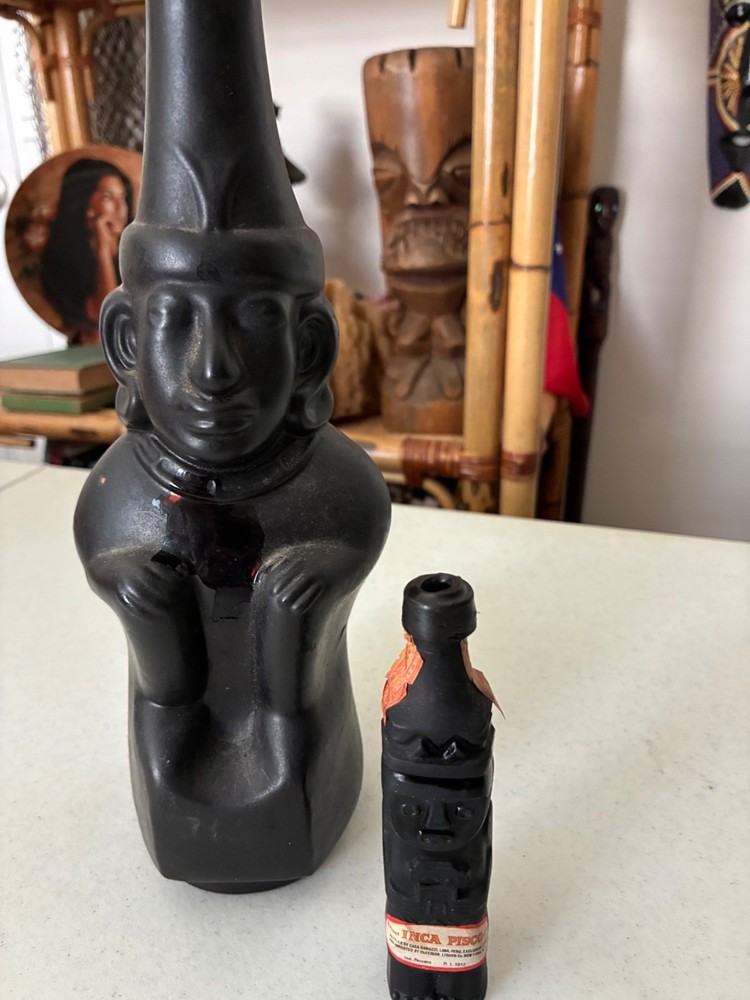 Two Empty Inca Pisco Bottles