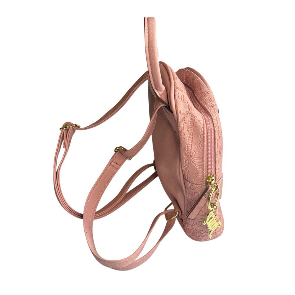 Backpack Elegant Juicy Couture backpack in blush. Embossed logo design. Includes