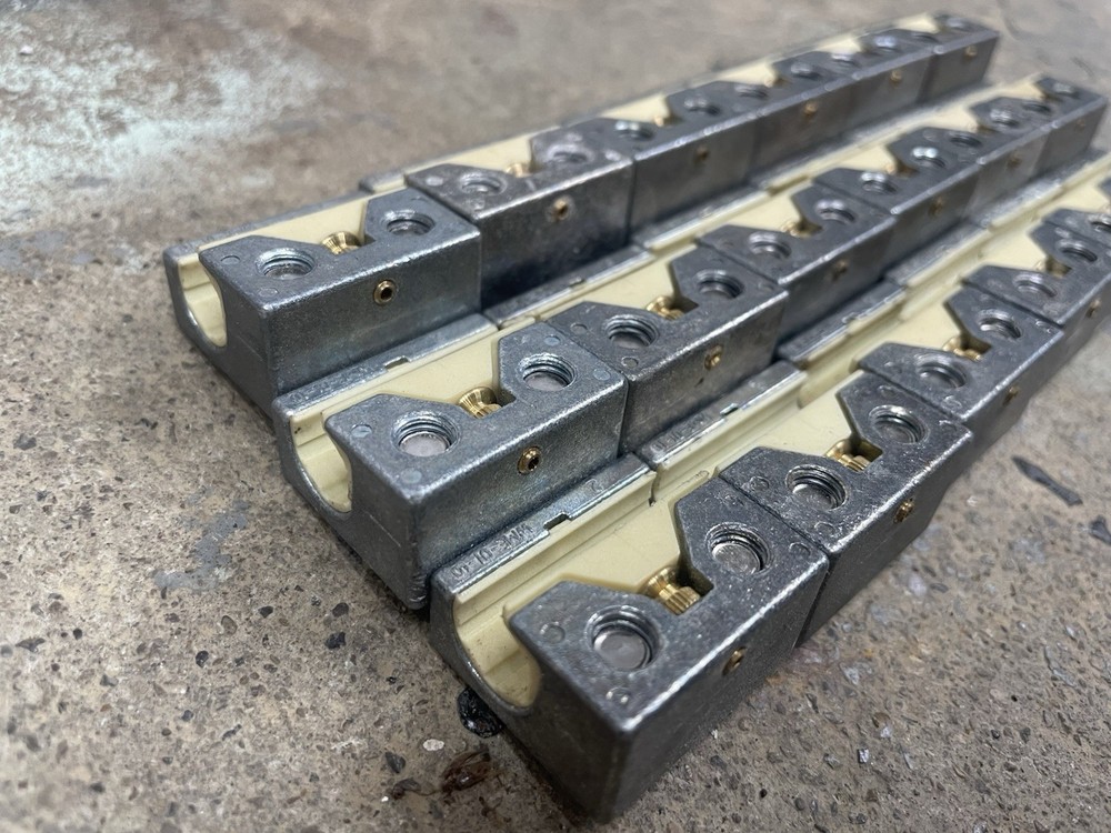 X18 Machine Rail Sliders with hardware for round rail, used