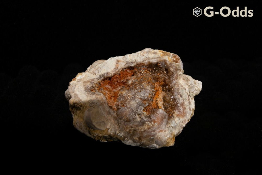 Rare broken geode around 2" with iron oxide and quartz